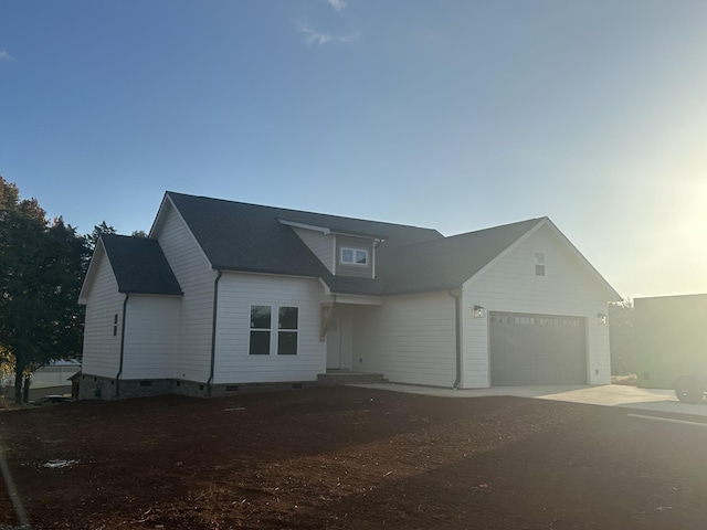 view of front of property with a garage