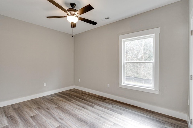 unfurnished room featuring light hardwood / wood-style flooring and ceiling fan