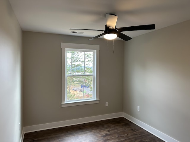 unfurnished room featuring ceiling fan and dark hardwood / wood-style floors