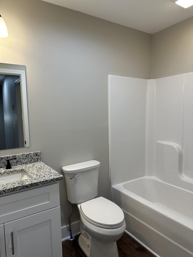 full bathroom featuring vanity, toilet, wood-type flooring, and  shower combination