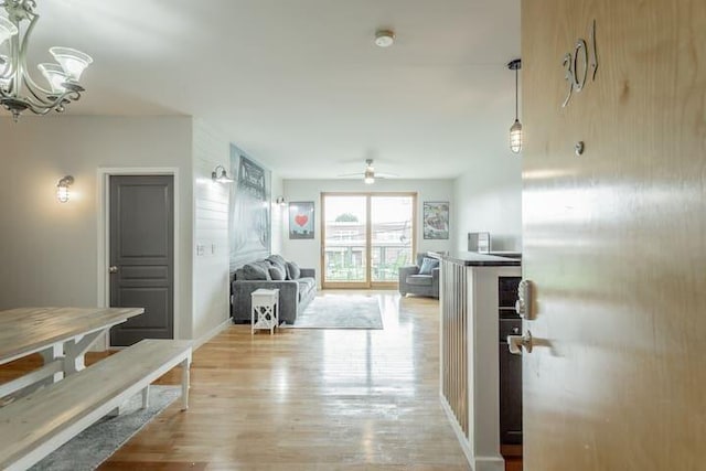 hall with light hardwood / wood-style floors