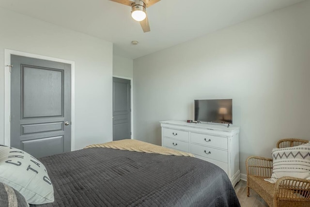 bedroom with light wood-type flooring and ceiling fan