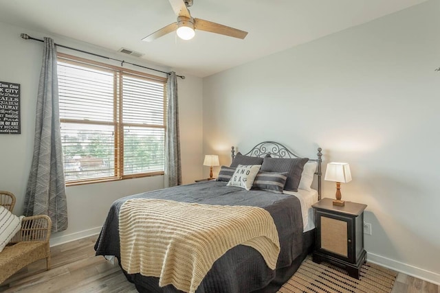 bedroom featuring ceiling fan and light hardwood / wood-style floors