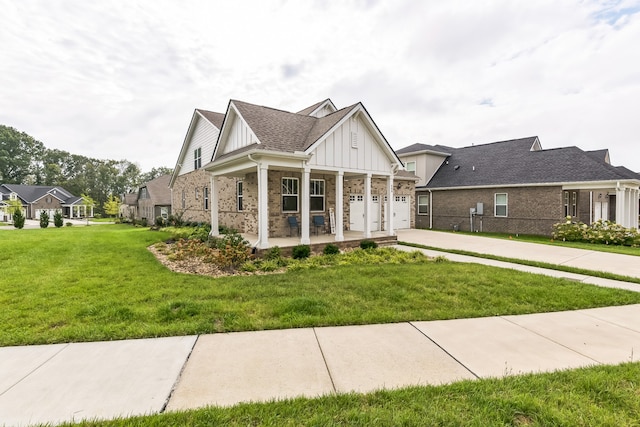 view of front of house featuring a garage and a front lawn