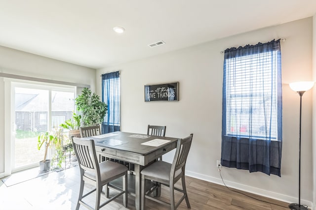 dining room with hardwood / wood-style floors