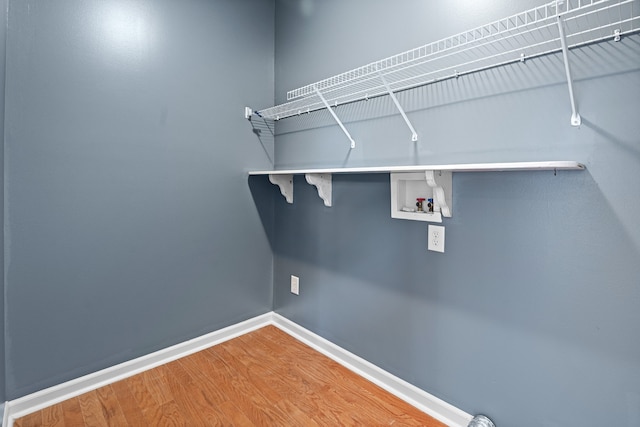 laundry area featuring wood-type flooring and hookup for a washing machine