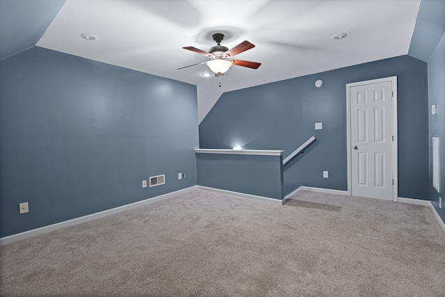 unfurnished room featuring lofted ceiling, carpet flooring, and ceiling fan