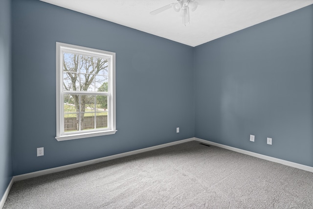 unfurnished room featuring carpet flooring and ceiling fan