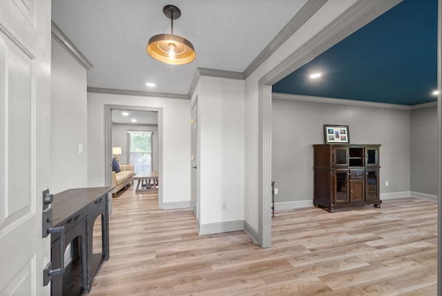 foyer entrance featuring light hardwood / wood-style flooring and ornamental molding