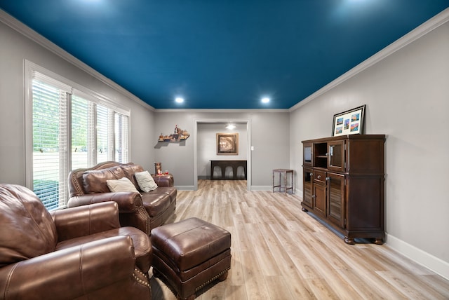 living room featuring light hardwood / wood-style flooring and ornamental molding