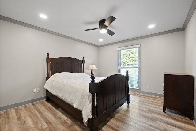 bedroom with ornamental molding, ceiling fan, and light hardwood / wood-style flooring