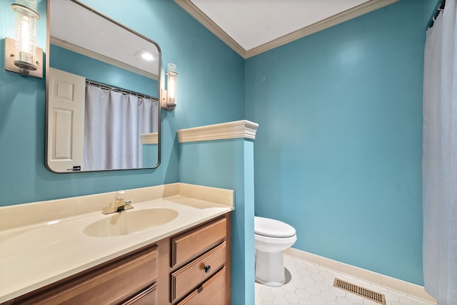 bathroom featuring ornamental molding, tile patterned floors, vanity, and toilet