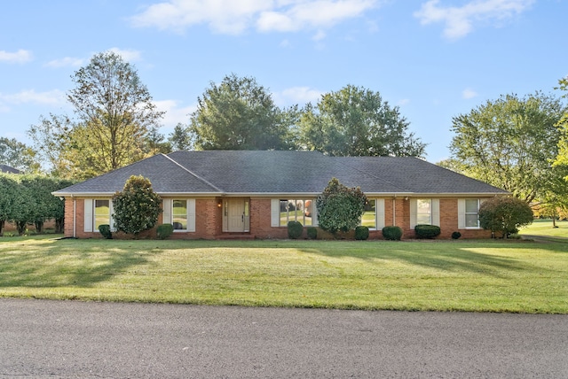 ranch-style home featuring a front yard