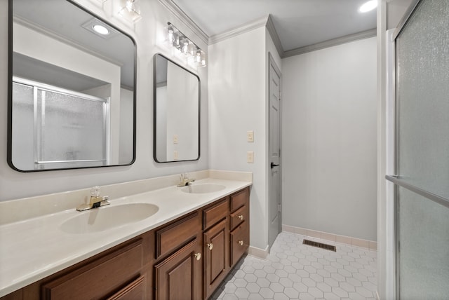 bathroom with tile patterned floors, walk in shower, vanity, and crown molding