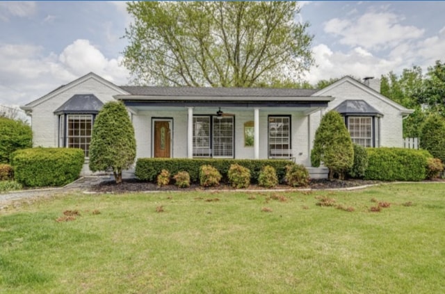 ranch-style house with a front lawn