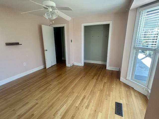 unfurnished bedroom with light hardwood / wood-style floors and ceiling fan