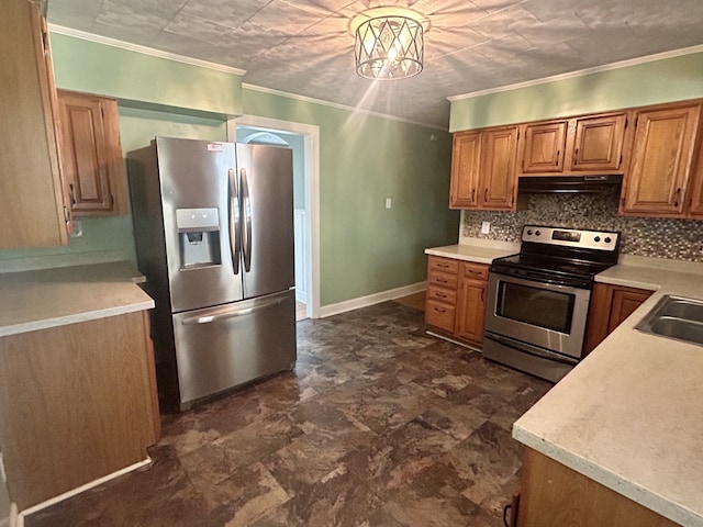 kitchen featuring appliances with stainless steel finishes, ornamental molding, a chandelier, and tasteful backsplash