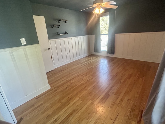 empty room featuring light hardwood / wood-style flooring and ceiling fan