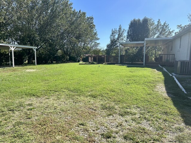 view of yard featuring central air condition unit