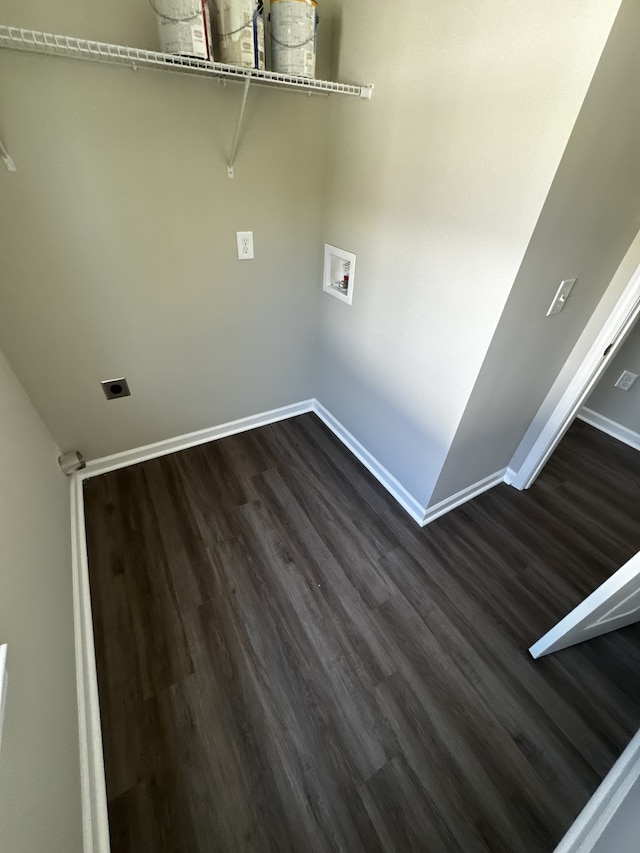 clothes washing area featuring hookup for an electric dryer, hookup for a washing machine, and dark hardwood / wood-style flooring