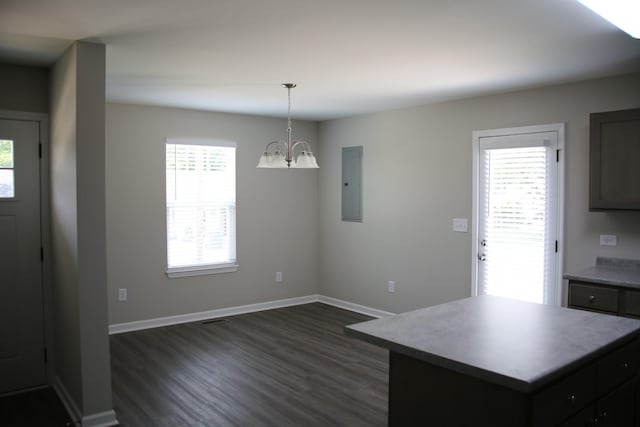 1603 Mantlo St, Springfield, TN 37172 - kitchen with electric panel, a chandelier, dark wood-style flooring, baseboards, and a kitchen island