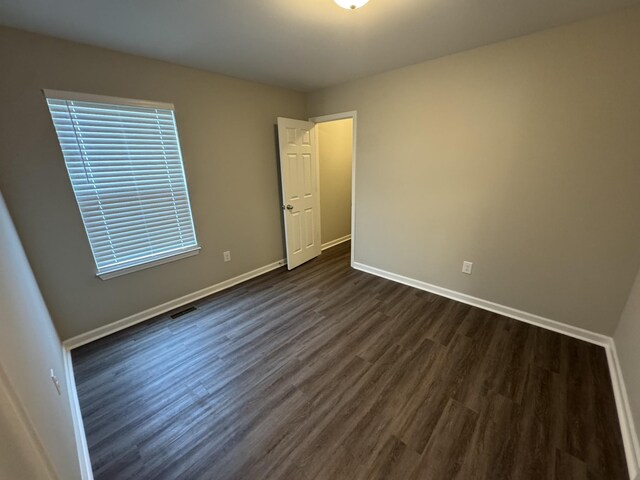 1603 Mantlo St, Springfield, TN 37172 - spare room featuring dark wood-style floors and baseboards
