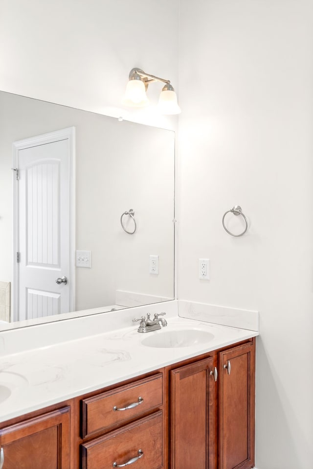 bathroom featuring double vanity and a sink