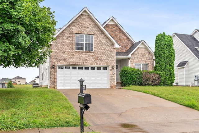 traditional-style house with a garage, concrete driveway, brick siding, and a front yard