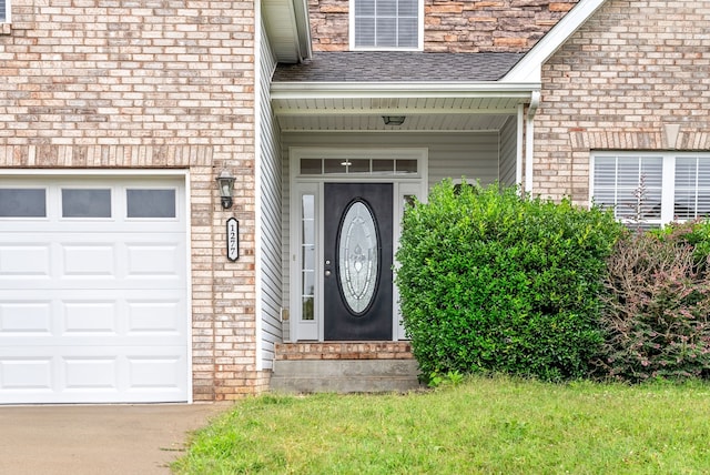 entrance to property featuring roof with shingles and brick siding