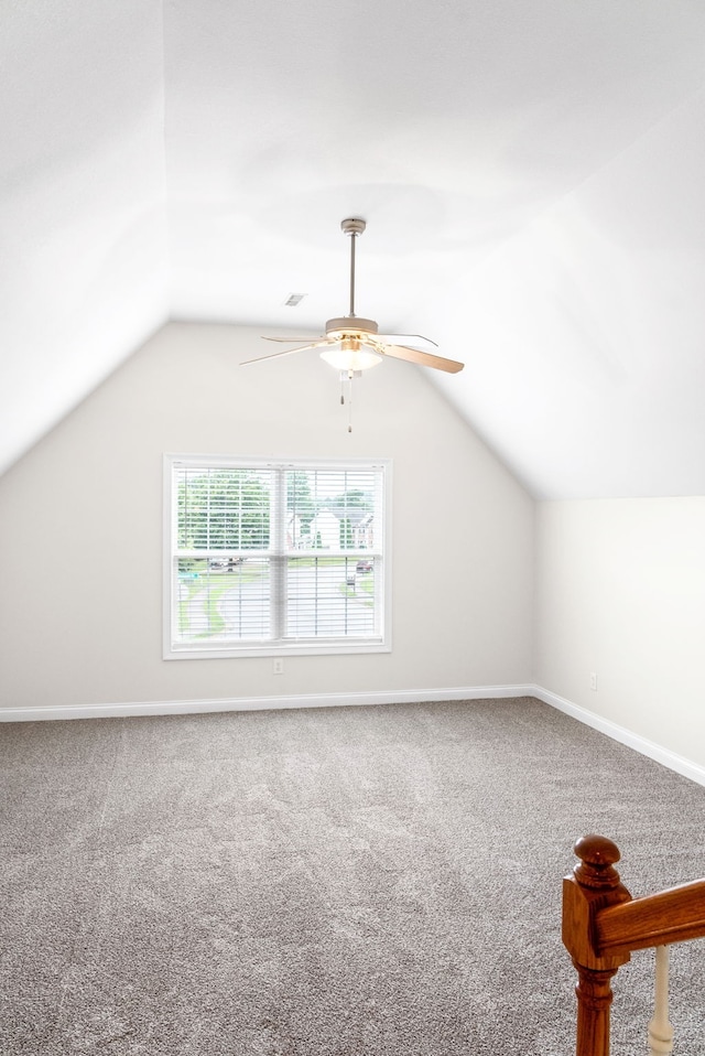 additional living space featuring lofted ceiling, carpet flooring, and ceiling fan