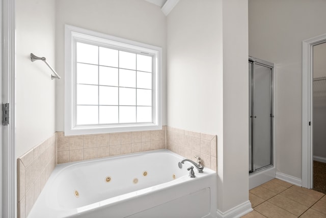 full bath featuring a stall shower, a spacious closet, a whirlpool tub, and tile patterned floors