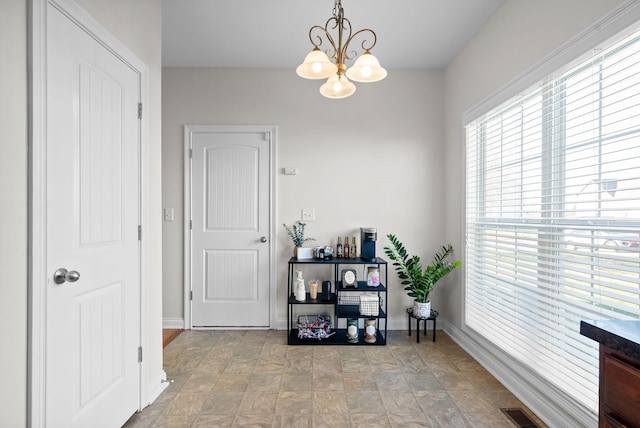 interior space featuring an inviting chandelier