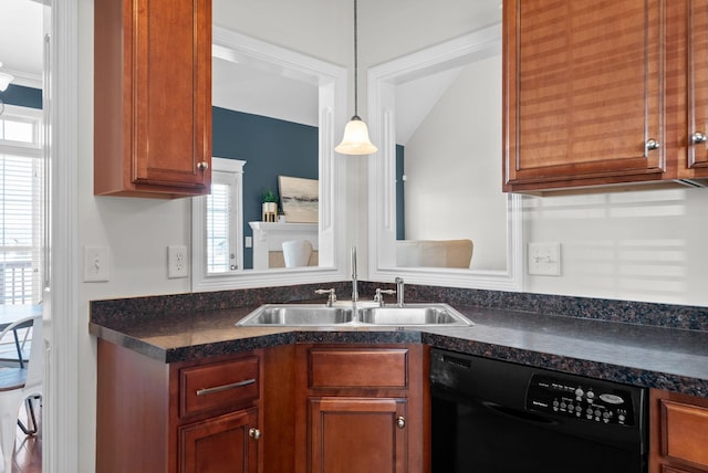 kitchen featuring pendant lighting, black dishwasher, and sink