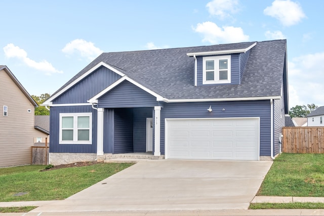 view of front facade with a garage and a front lawn