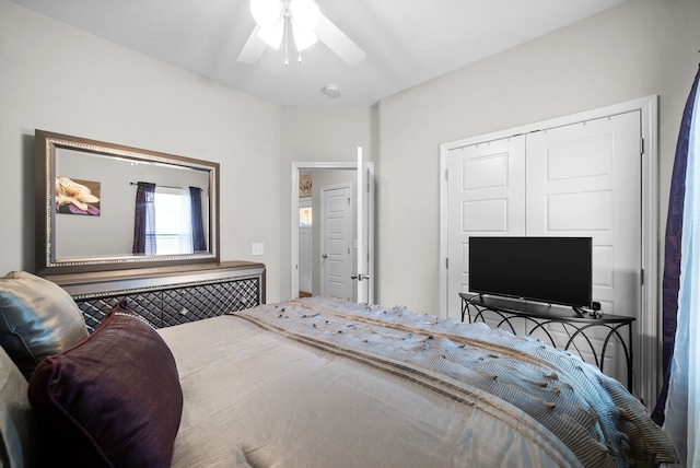 bedroom featuring ceiling fan and a closet