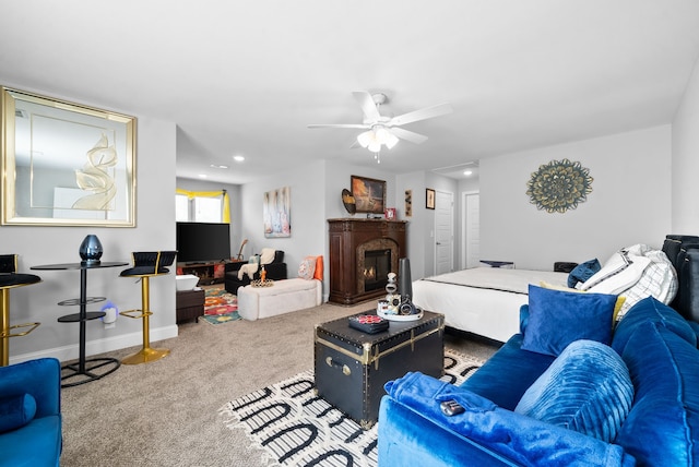 living room with ceiling fan and carpet floors