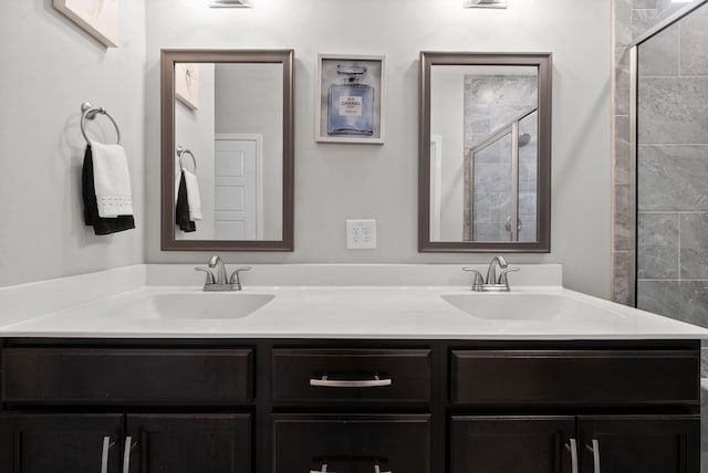 bathroom with vanity and an enclosed shower