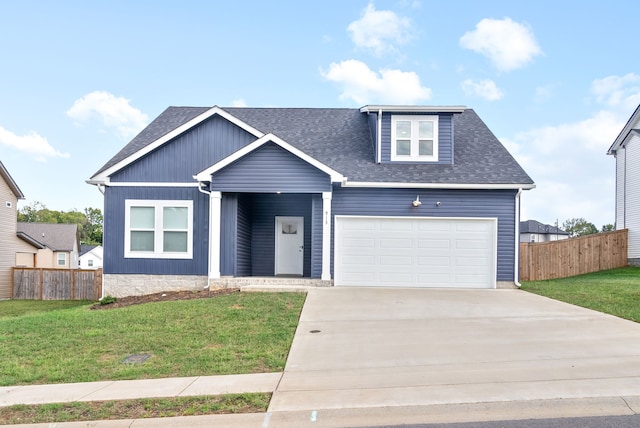 view of front facade with a front yard and a garage