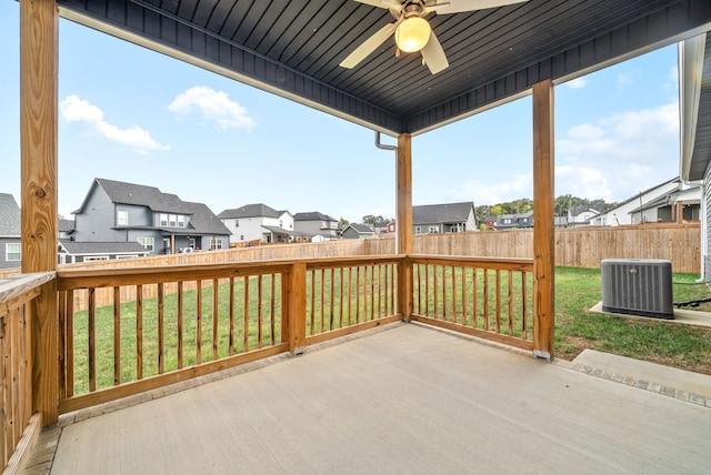 deck featuring a patio, cooling unit, ceiling fan, and a yard