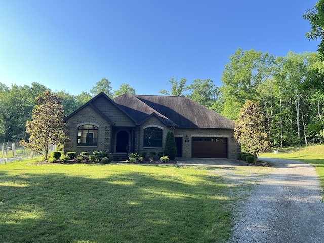 view of front of home featuring a garage and a front lawn