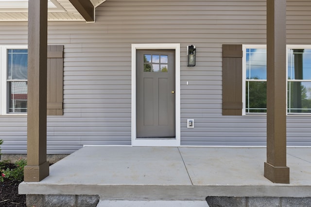 entrance to property with a patio