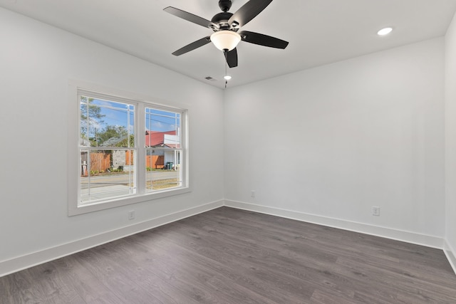 unfurnished room featuring dark hardwood / wood-style flooring and ceiling fan