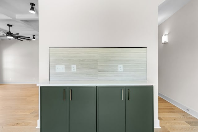 details featuring beam ceiling, ceiling fan, hardwood / wood-style floors, and coffered ceiling