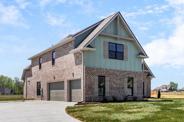 view of side of home featuring a lawn and a garage