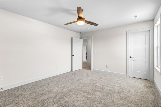 unfurnished bedroom featuring ceiling fan and carpet floors