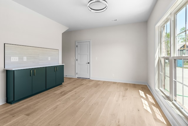 unfurnished room featuring light hardwood / wood-style flooring