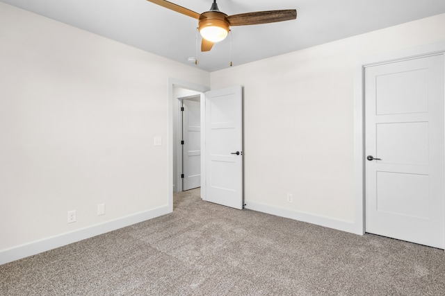 unfurnished bedroom with light colored carpet and ceiling fan