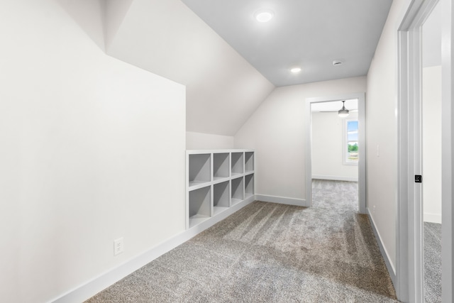 bonus room featuring carpet flooring and lofted ceiling