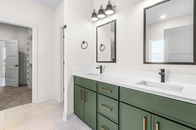 bathroom with tile patterned floors and vanity