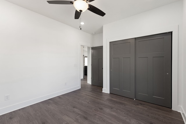 unfurnished bedroom with a closet, ceiling fan, and dark hardwood / wood-style flooring